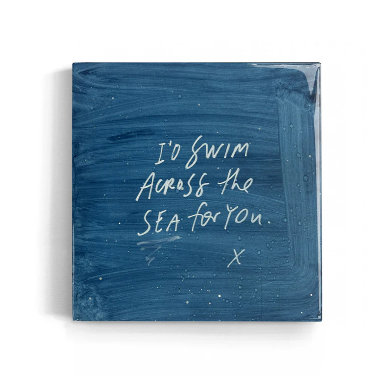 Blue textured square with white text 'I'd swim across the sea for you.'