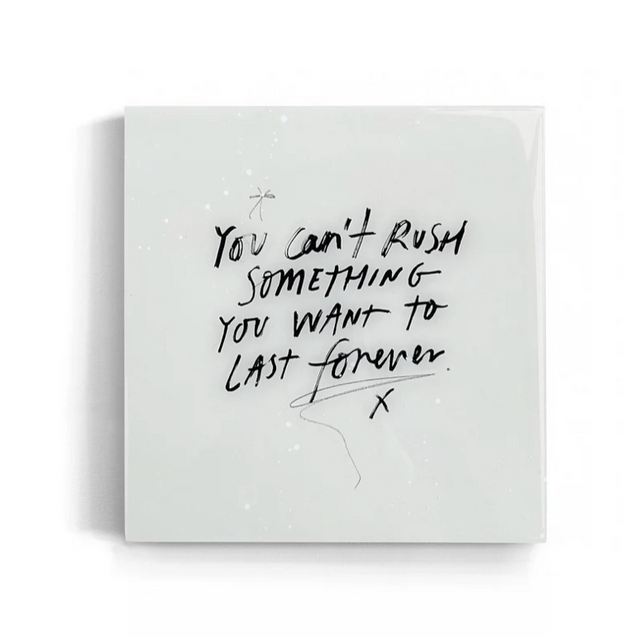 White square quote wall art tile with black text on a white background