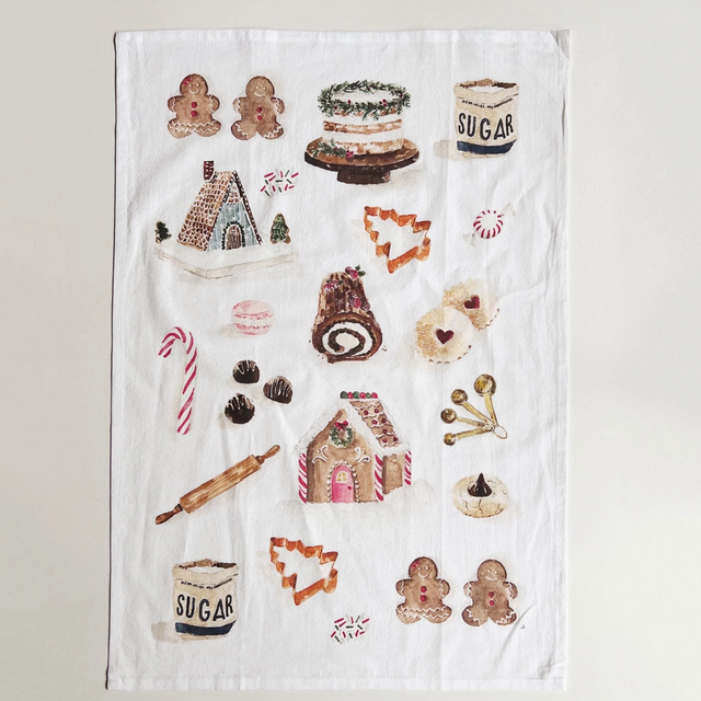 Decorative towel with baking-themed illustrations on a white background