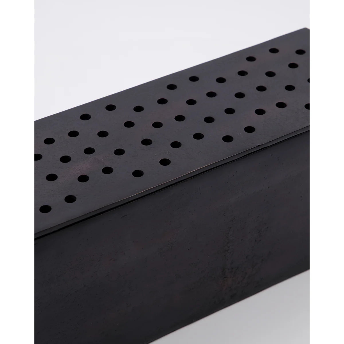 Black metal vase or flower holder perforated design on a white background